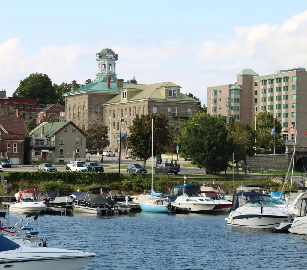 Scenic town-to-town travel in Canada with a small regional destination in the background