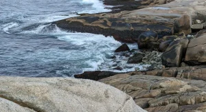 Rocky shoreline in Canada with calm water