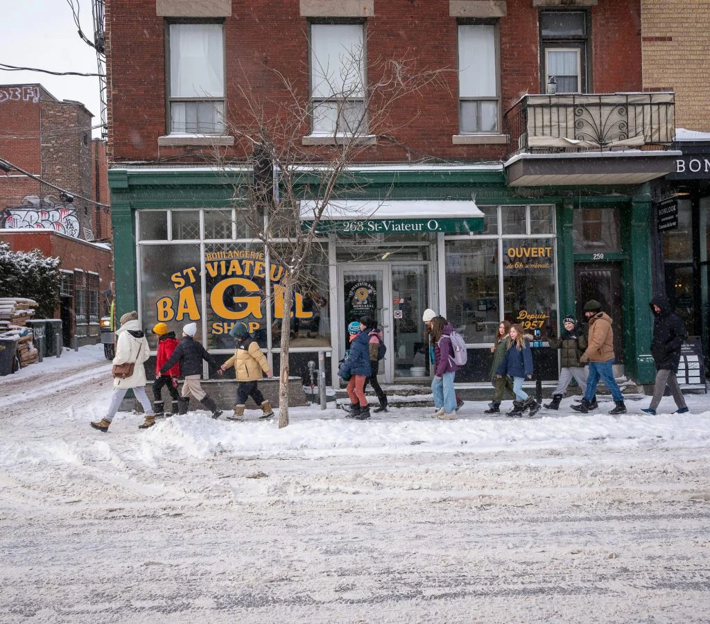 People gathering at a cozy Canadian café, reflecting neighborhood culture