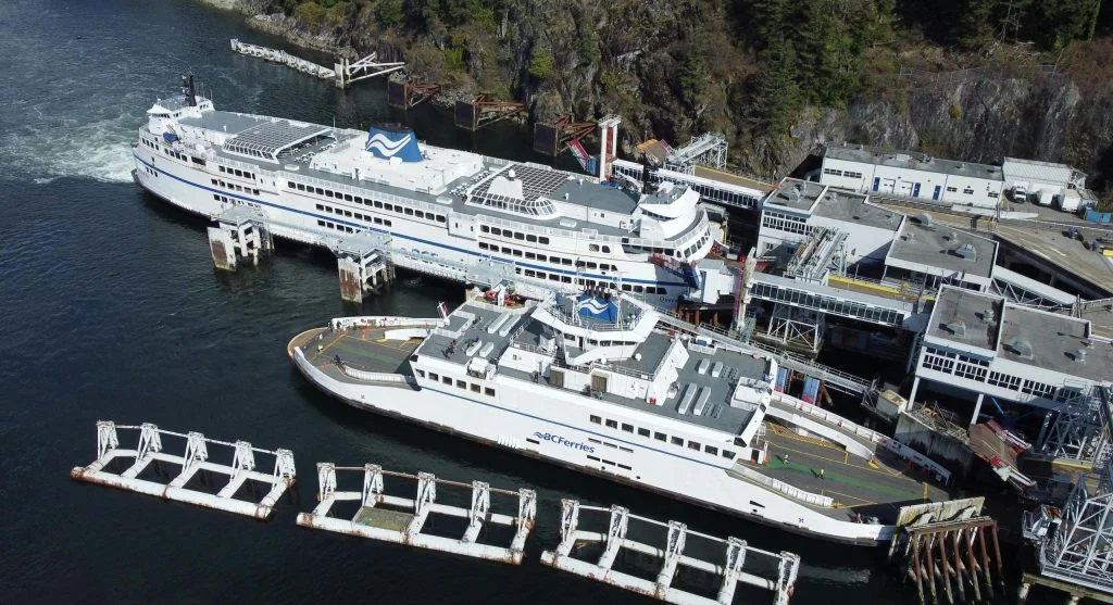 Ferry boat docking at a small harbor in Canada