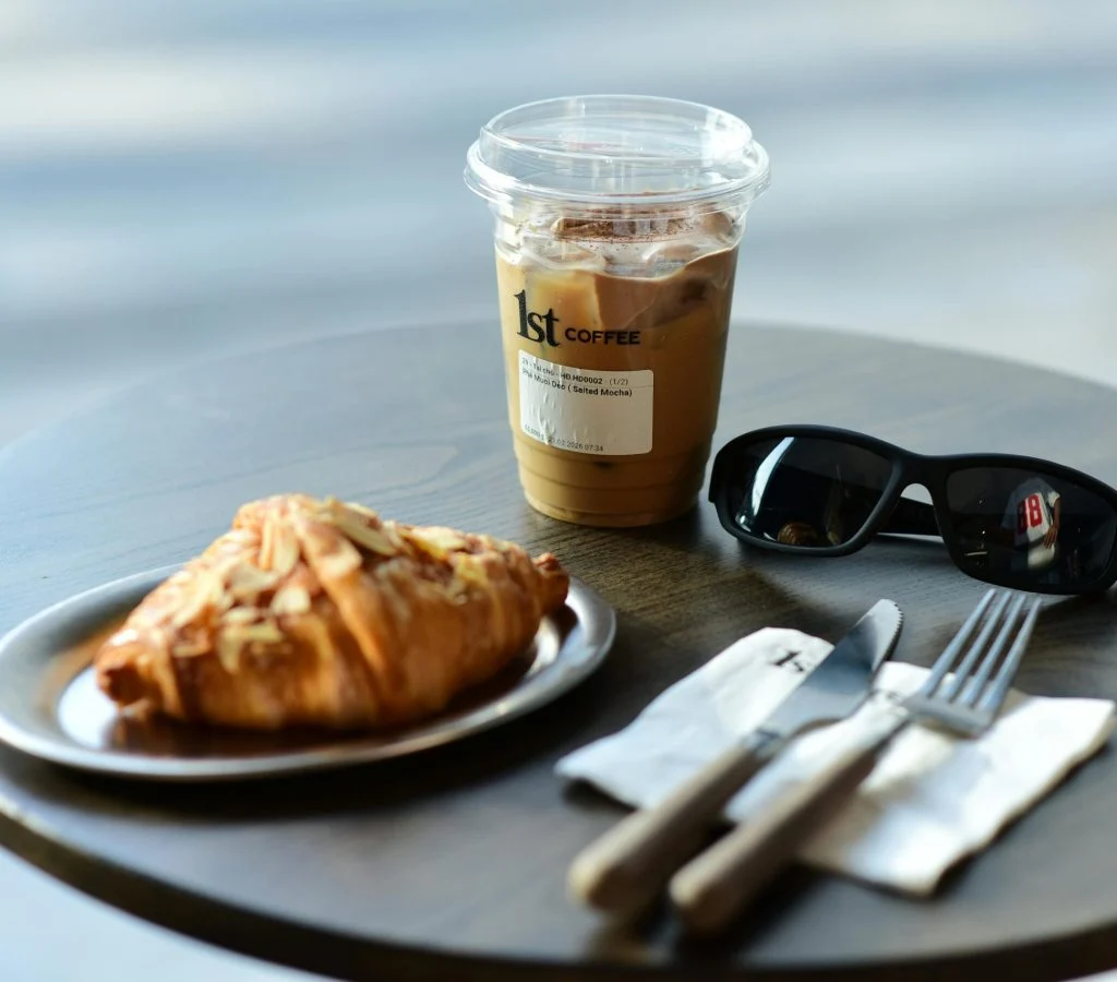 Cozy Canadian café scene with people enjoying morning coffee and pastries