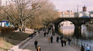 Riverfront cityscape in Canada with walking paths and water views