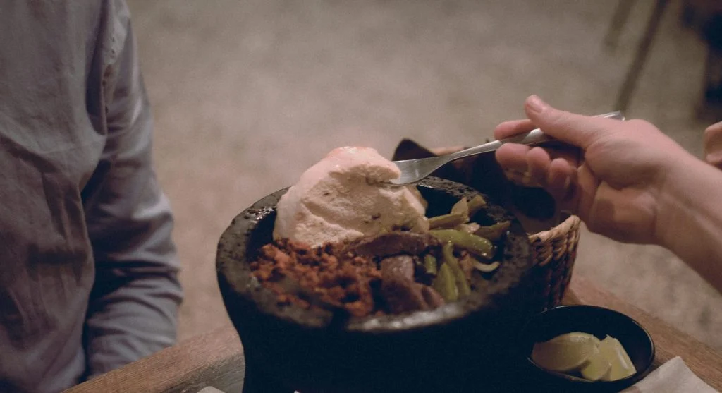 People from different cultures sharing meals in a modern Canadian food hall