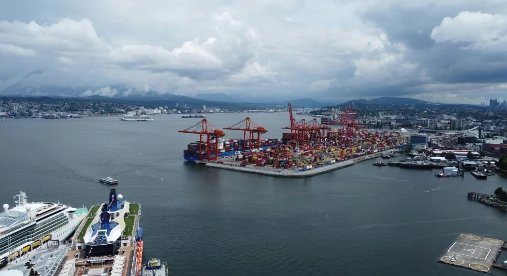 Aerial view of a bustling Canadian harbor city with waterfront activity