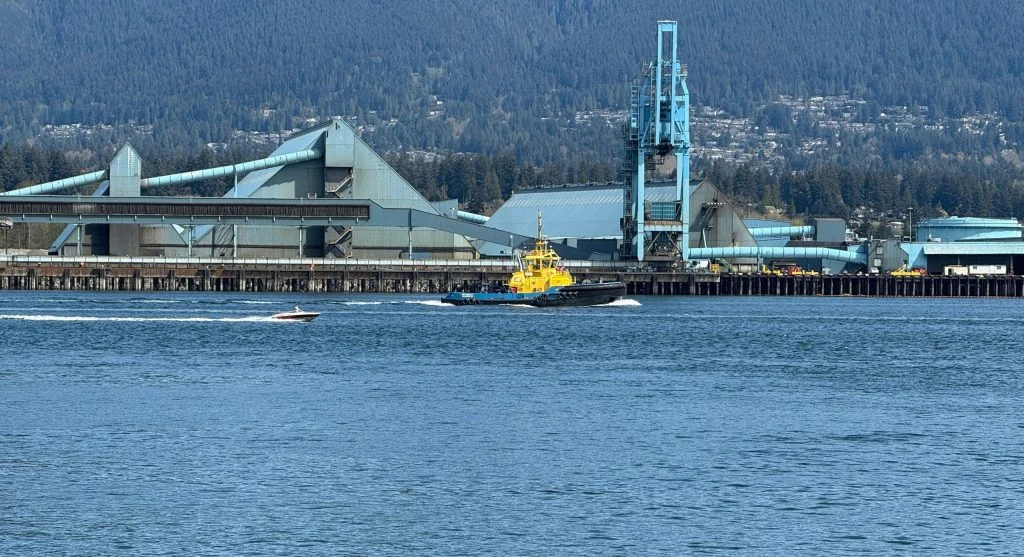 Photo of a bustling Canadian harbor city with a working waterfront