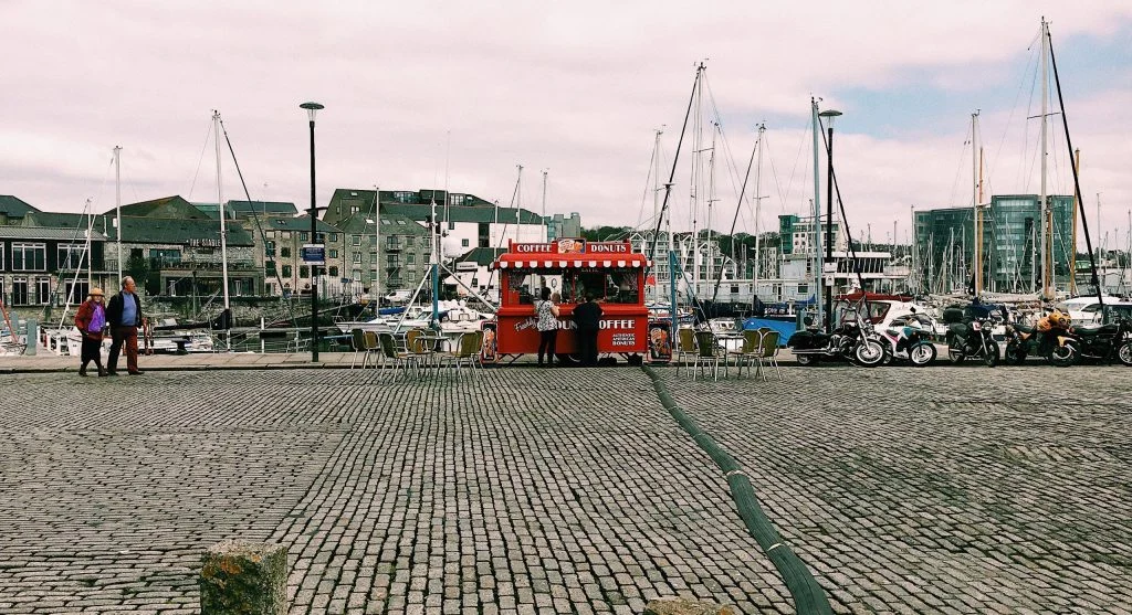 Canadian harbor city with public waterfront food spaces and daily movement